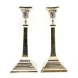 A pair of silver candlesticks,