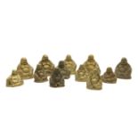 A collection of brass Buddahs,