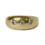 A 9ct gold three stone diamond ring,