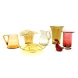 A collection of mixed coloured glassware,