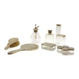 A collection of silver dressing table items