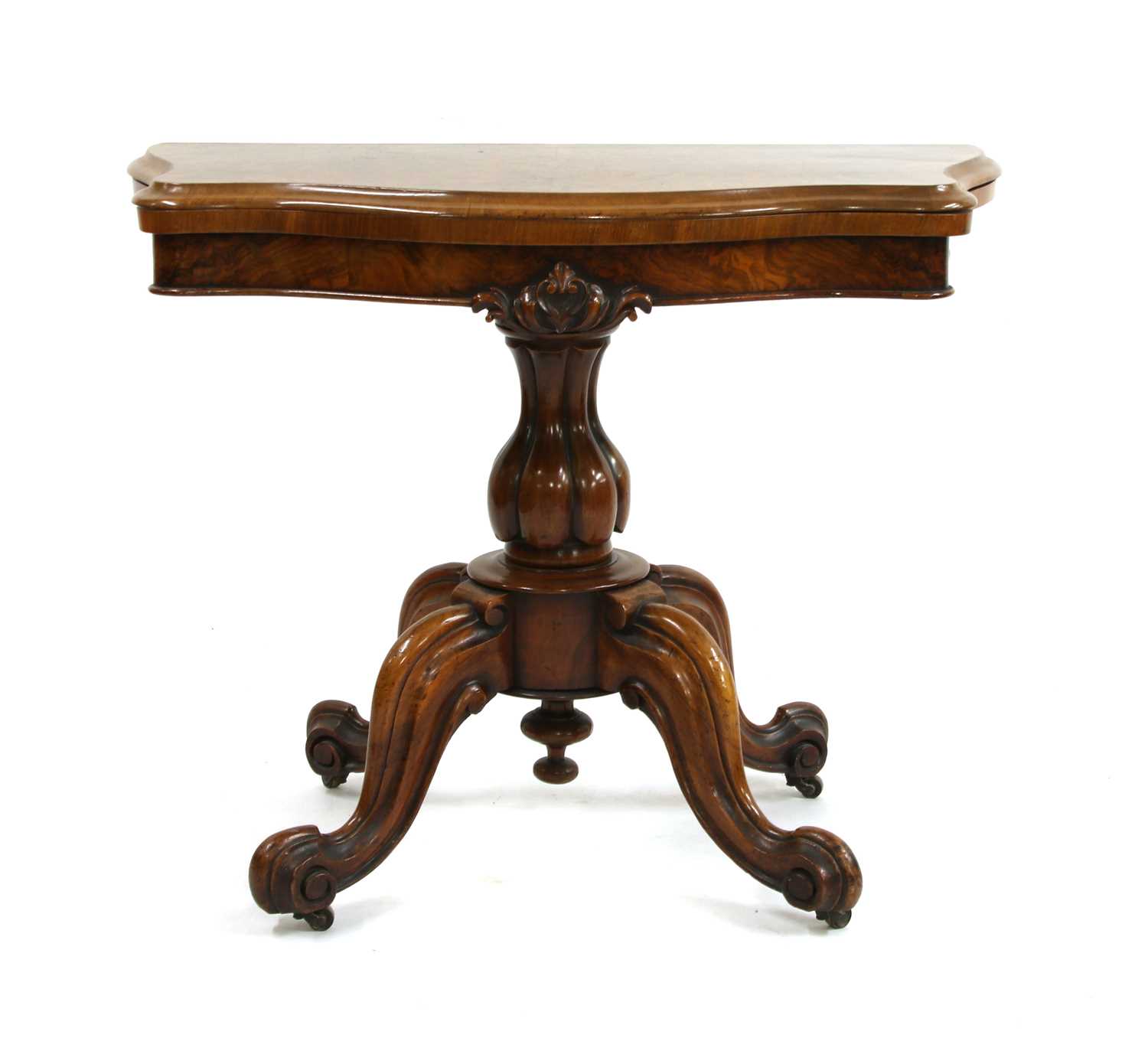 A Victorian walnut fold over top card table,