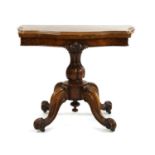 A Victorian walnut fold over top card table,