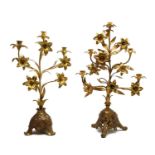 A near pair of continental gilt candle stands,