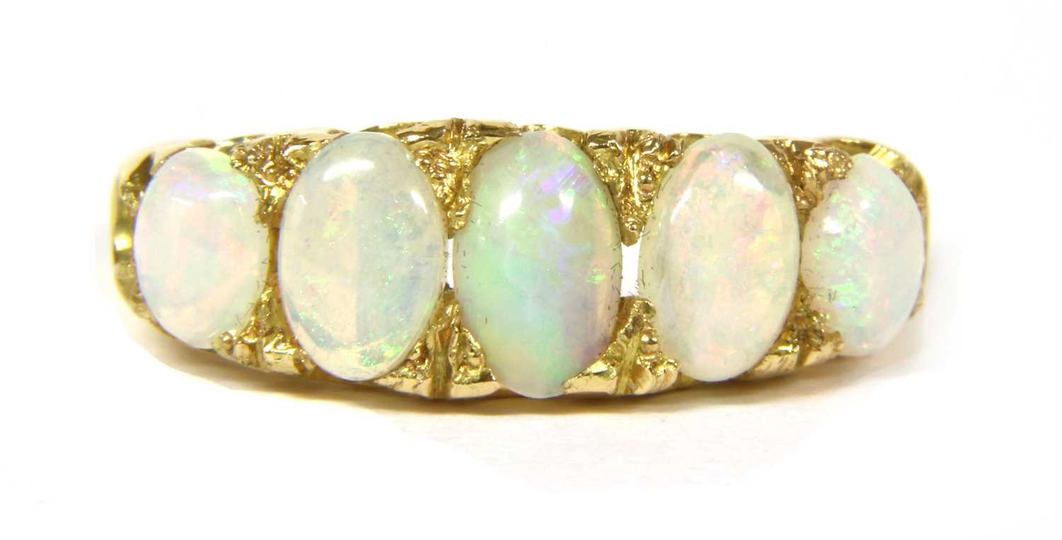 A gold five stone opal ring,