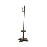 An early iron candle and rush light holder,