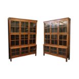 A pair of glazed oak bookcases,