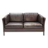 A Danish brown leather two-seater settee,