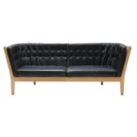 A three seater leather settee,