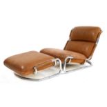 A tan leather and chrome lounger and stool,