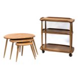 An Ercol nest of three 'Pebble' tables,