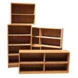 Five various sizes of oak bookcases,