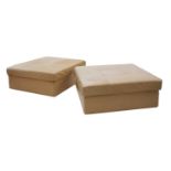A pair of Danish tan leather pouffes,