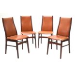 Four Danish tan leather dining chairs,