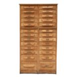 An oak chest of twenty-six drawers,