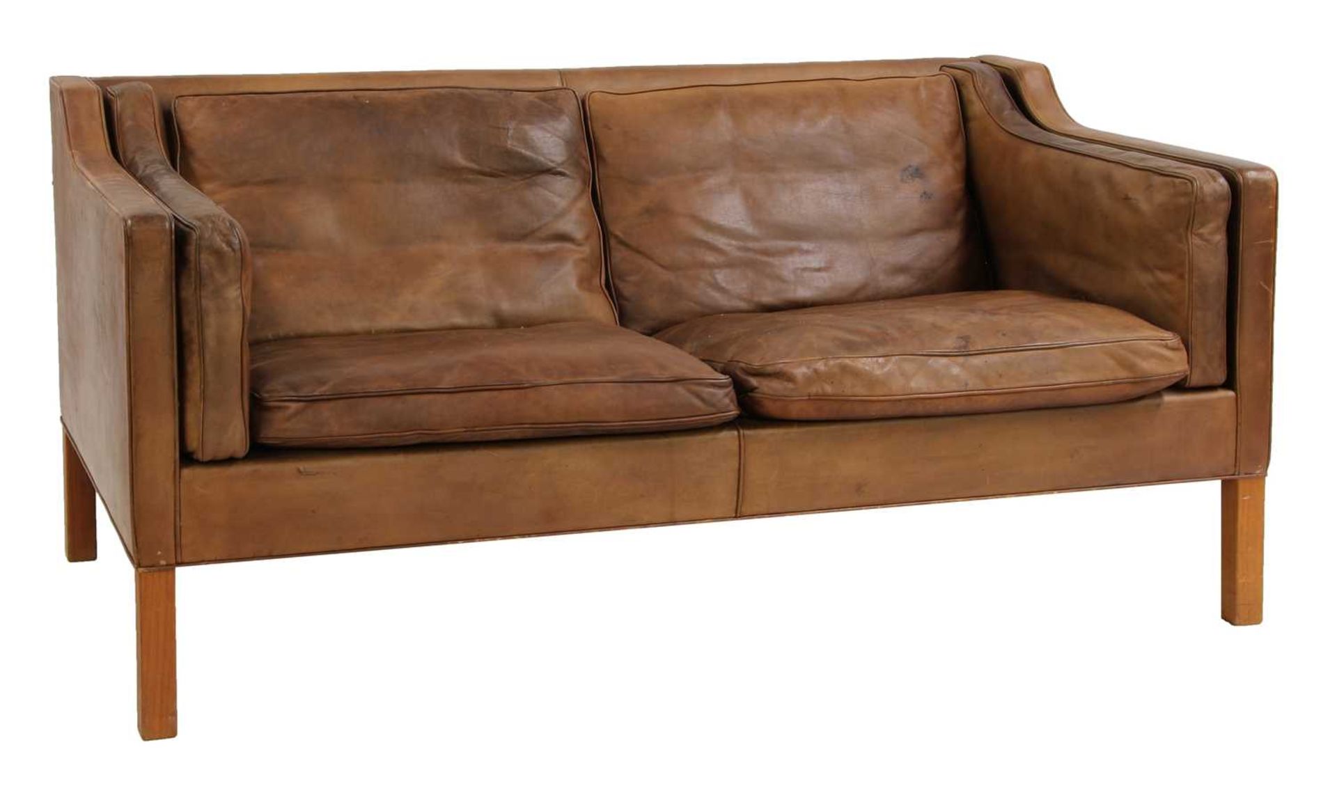A brown leather 2212 settee,