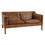 A brown leather 2212 settee,