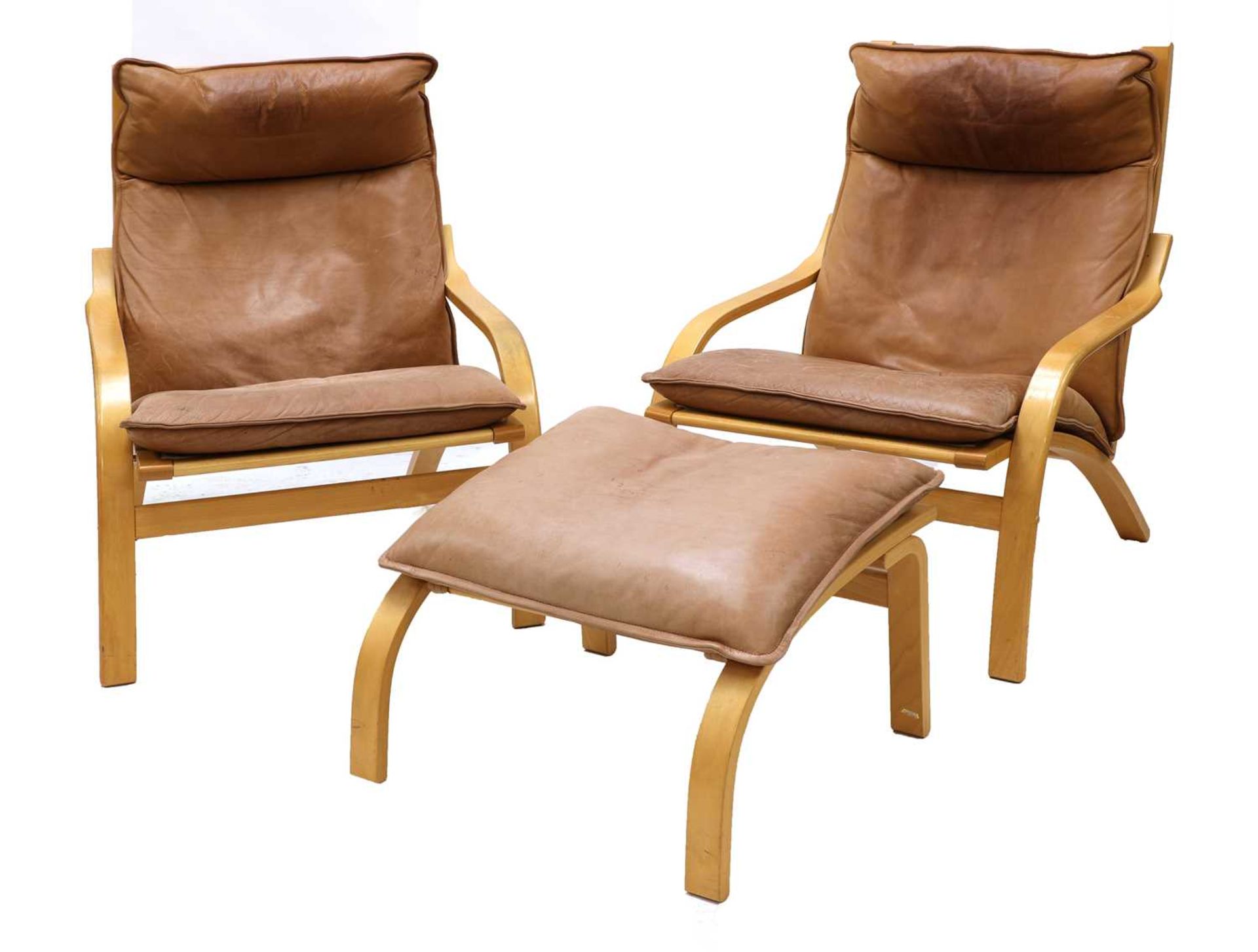 A pair of Scandinavian leather armchairs,