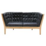 A two-seater leather settee,