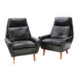 A pair of Danish black leather armchairs,