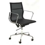 A black mesh and chrome office chair,