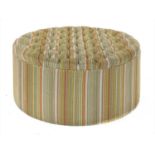 A contemporary circular pouffe,