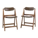 A pair of folding oak chairs,