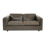 A 'Petrarch' brown leather two-seater sofa,