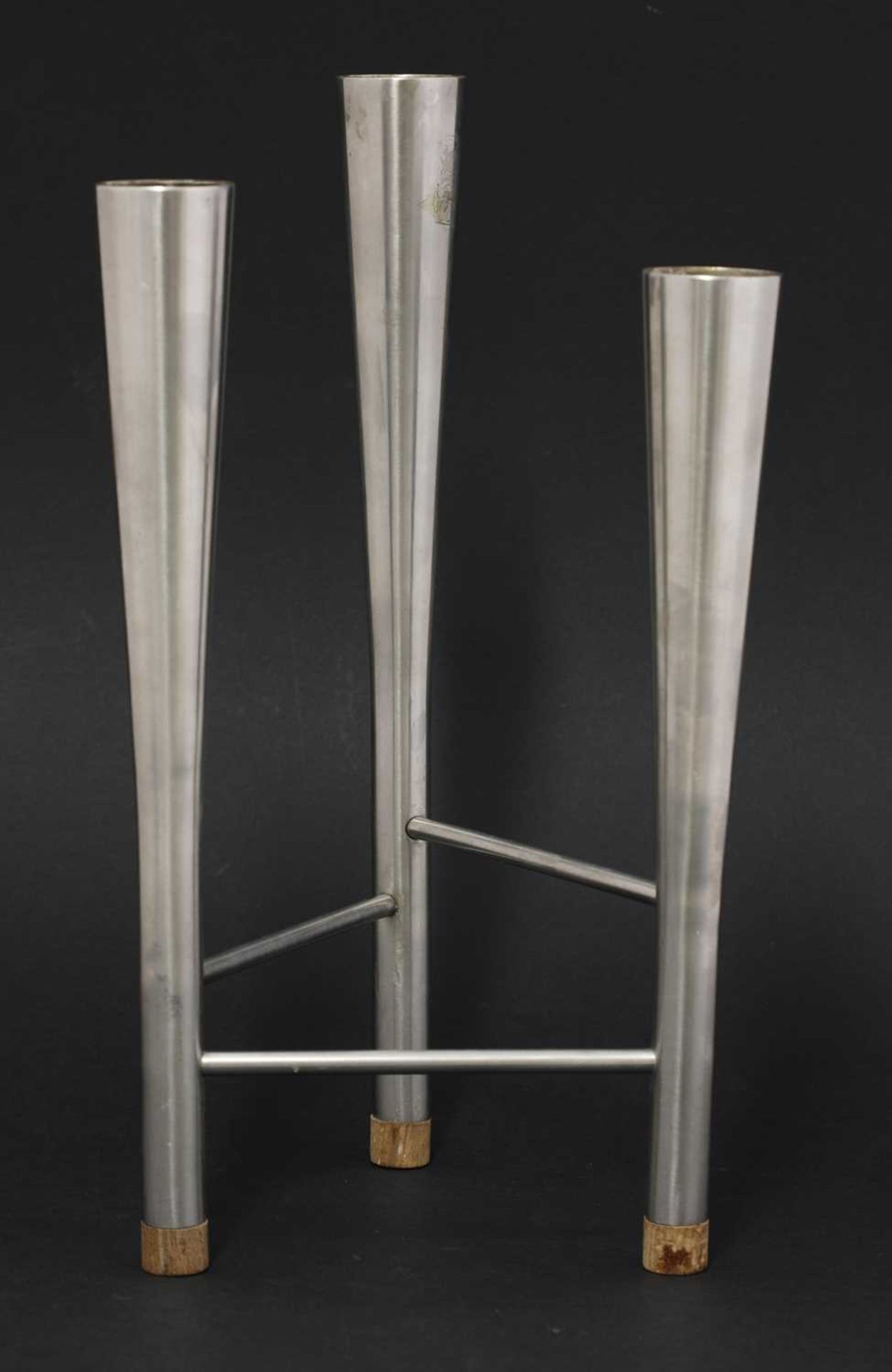 A Campden stainless steel three branch candlestick,