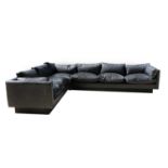 A Danish black leather corner settee,