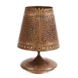 A large copper table lamp and shade,