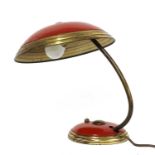 An Helo red enamel brass deck lamp,
