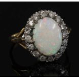 An 18ct gold opal and diamond oval cluster ring,