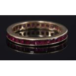 A gold ruby flat section full eternity ring,