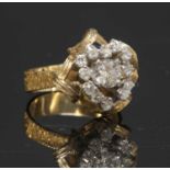 A two colour gold diamond set cluster ring, c.1970,