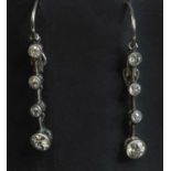 A pair of gold diamond drop earrings,