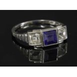 An Austrian Art Deco three stone synthetic sapphire and diamond ring,