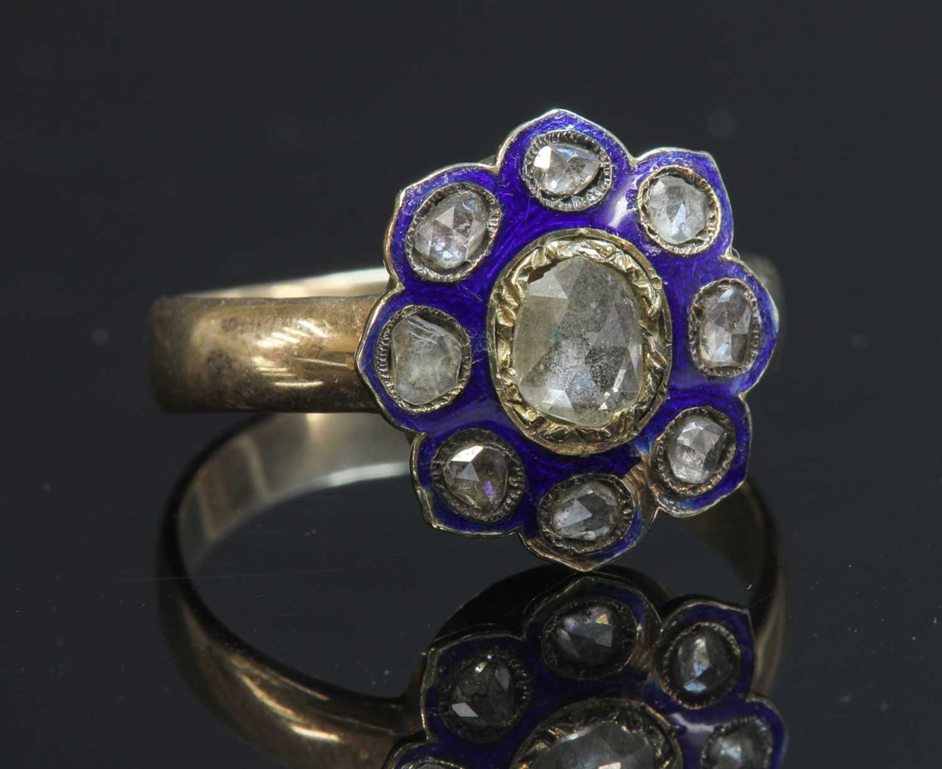 A rose cut diamond and enamel cluster,