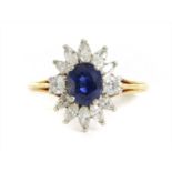 A gold sapphire and diamond cluster ring,