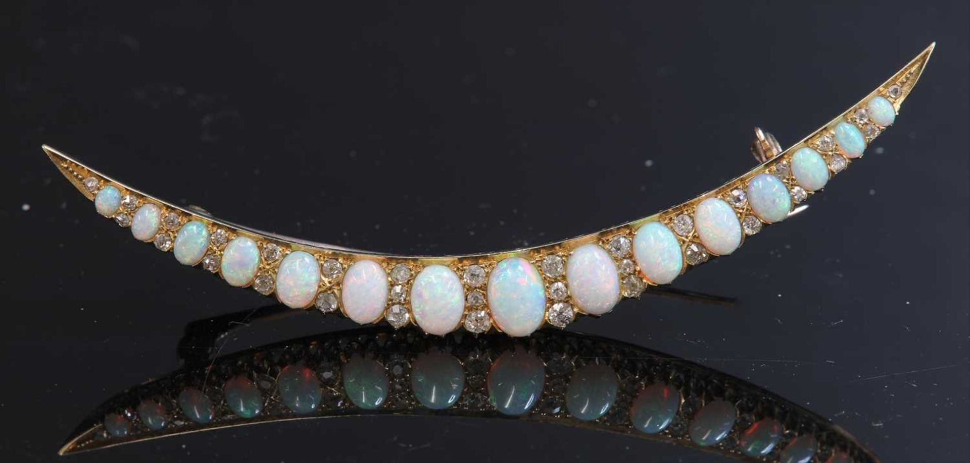 A late Victorian gold opal and diamond crescent brooch, c.1890,