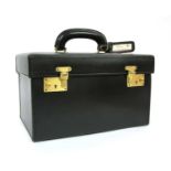 A Pendragon black leather vanity case