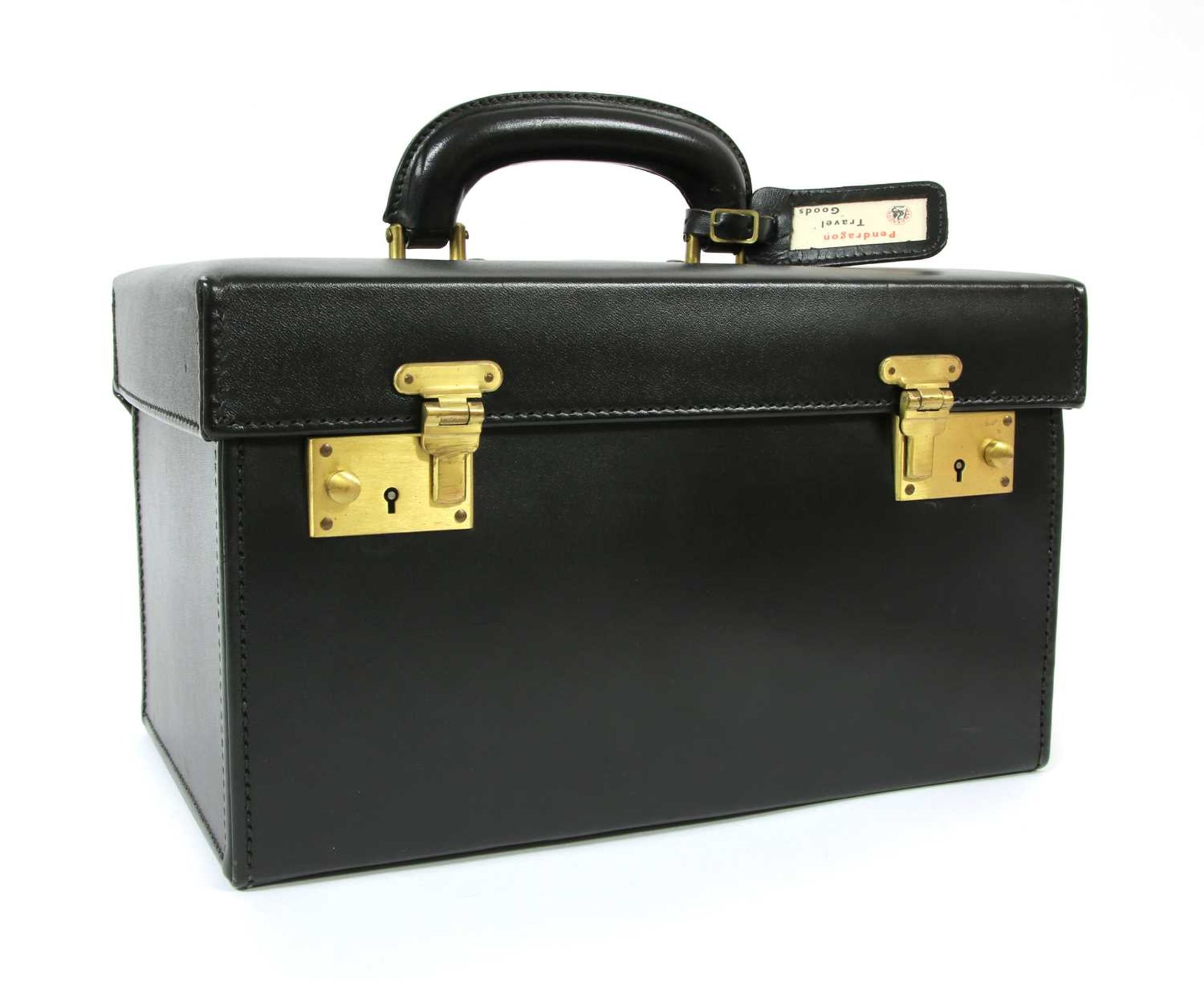 A Pendragon black leather vanity case