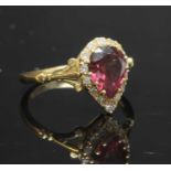 An 18ct gold garnet and diamond pear-shaped cluster ring,