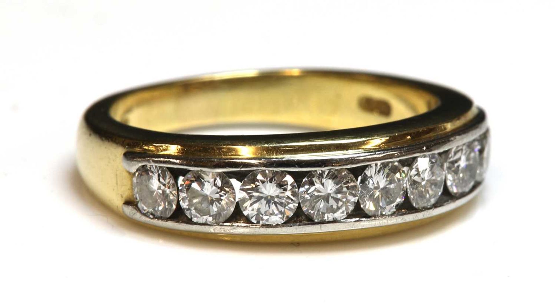 An 18ct two colour gold diamond set half hoop ring by Boodle & Dunthorne, c.2000,