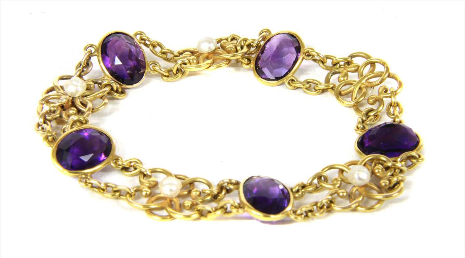 An Edwardian gold amethyst and pearl bracelet,