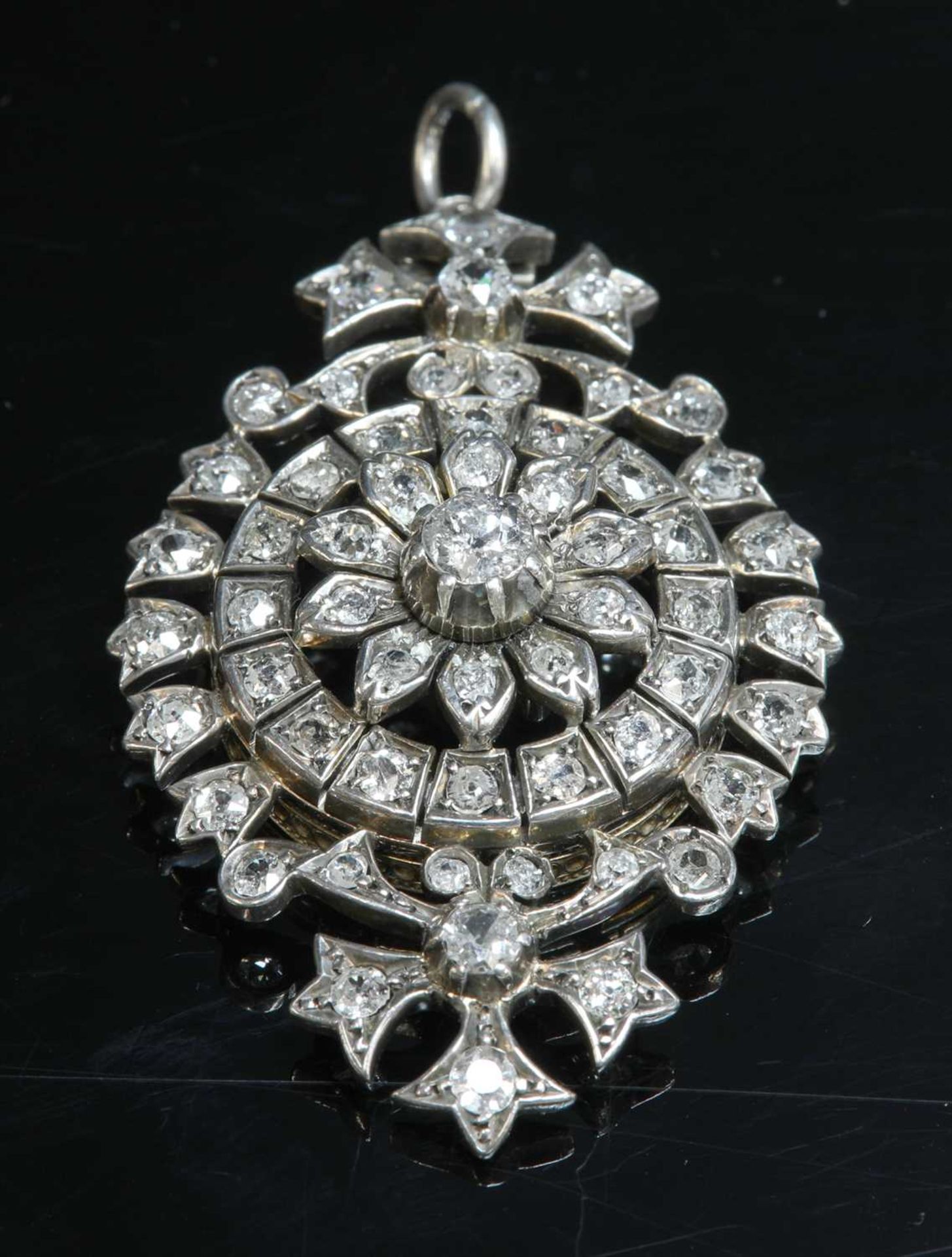 A late Victorian diamond set target-style brooch/pendant, c.1880,