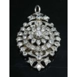 A late Victorian diamond set target-style brooch/pendant, c.1880,