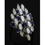 A white gold diamond and sapphire marquise-shaped cluster ring,