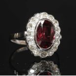 A spinel and diamond oval cluster ring,
