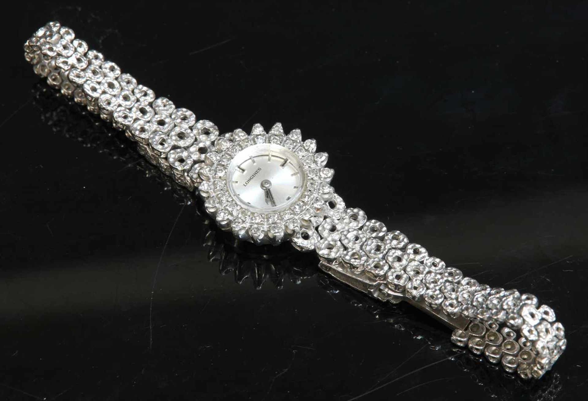 A ladies' 18ct white gold Longines diamond set mechanical bracelet watch, c.1970,